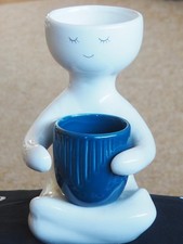Lovely 20cm Ceramic Planter Garden Plant Decor Person Holding a Blue Pot.