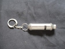 collectors item unused vintage keyring in the shape of a whistle