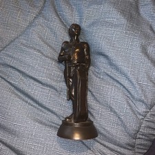 bronze-finish golfer statue, possibly made from resin with a metallic coating