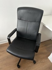 Black leather office chair with adjustable height 
