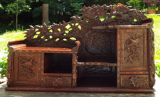 A  LARGE WOODEN PROFUSELY