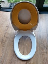 Brand new- Family toilet seat with funky yellow toddler seat