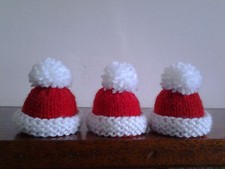 3 CHRISTMAS HAT HAND KNITTED EGG COSIES / BOTTLE TOPPERS. SMALL HATS