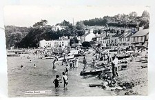 Children Paddling By Boats