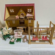 Sylvanian Families Red Roof House furniture, swing, seesaw, and a set of items