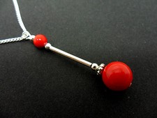  A LOVELY RED CORAL BEAD