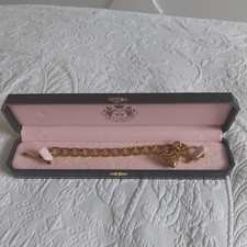 Juicy Couture Gold Tone Charm Bracelet. 18.5CM in original box ex condition 