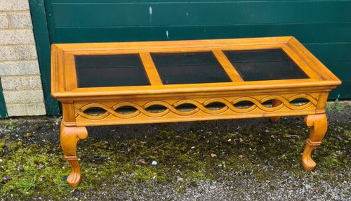 Glass topped coffee table