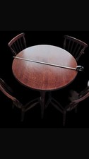 40-inch diameter mahogany stained finish dining table with 4 chairs. Collect WN2