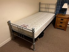 2 matching single beds with