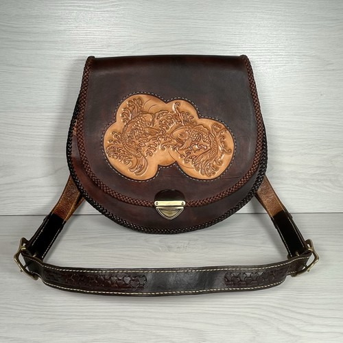 Hand tooled leather - tooled,