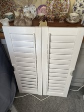 white pvc window shutters