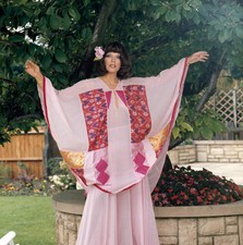 Joan Collins wearing the