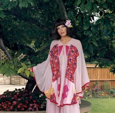 Joan Collins wearing the