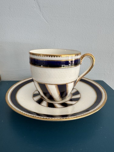 Antique teacup and saucer - and,