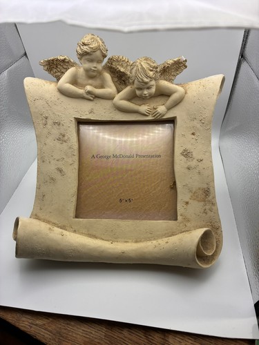 Picture frame cherub scroll