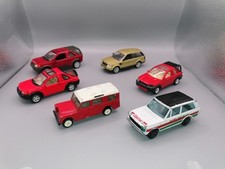 collection of 6 diecast vehicles. Landrovers 1.43 scale
