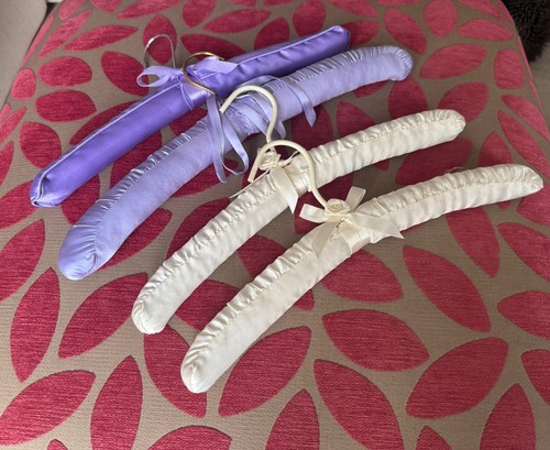 Four padded hangers - in, cream