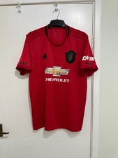 Red Adidas sport top size L.Manchester united badge and Chevrolet logo.