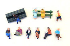 SEATED CIVILIAN FIGURES