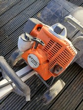 Stihl MM56 Multitool fitted Stih cradle and wheel set, and bristle brush