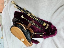 7 keyed Burleigh pipe set in F. Also a 9-keyed chanter with drones and bellow