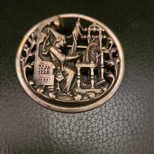 Old spinning wheel brooch