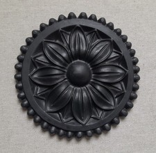 A 13.5cm black resin carved