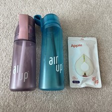 Two Air up Bottles And Apple
