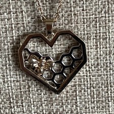 Gold and silver tone honeycombe and bee necklace