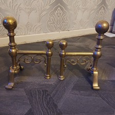 Pair of antique brass fire
