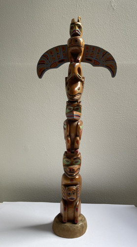 Hand carved totem pole - hand,