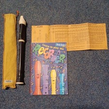 Aulos Descant Recorder With Cloth Case leaning books and instruction