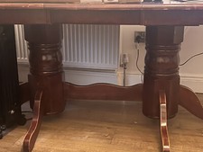 solid wooden extendable/foldable table and 5 cushioned chairs, dark brown. 