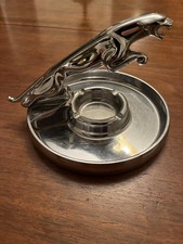Jaguar leaping cat emblem