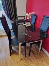 Black Glass 4 Seater Extending Dining Table from Harveys