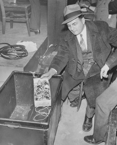 Man holds box dentures left - holds, of