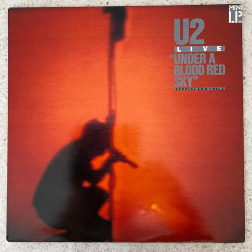 Live under a blood red - "under,