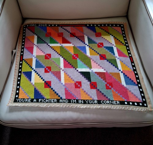 Hand stitched with anchor - with,