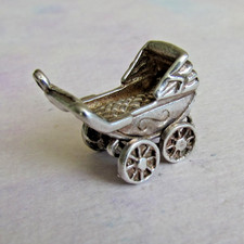 VINTAGE SILVER MOVING PRAM