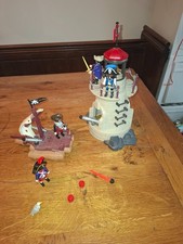Playmobile Pirate Lighthouse and Raft. Good condition. Includes Pirates