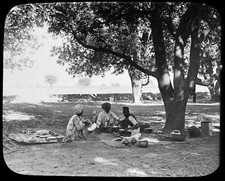 INDIAN MEN EATING A MEAL UNDER