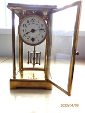  Four glass, brass clock