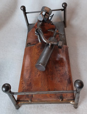 METAL NUTS, BOLTS ART SCULPTURE OF GOLFER IN BED, HUGGING HIS GOLF CLUBS!