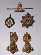 Assorted military badges &