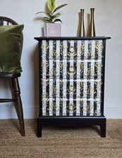 Stag Minstrel mid-century black and gold chest of drawers, bedside drawers