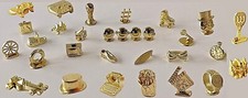 Monopoly Various Golden tokens: bowtie, Chinese Lucky Cat, Vintage Watch, TV ...