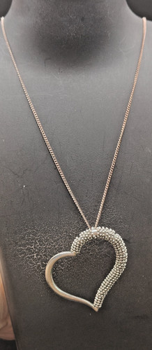 Next silver tone - next, heart