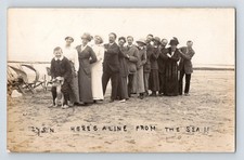 Social History RPPC: Conga Line Of People & Dog On The Beach At The Seaside.