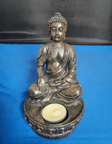 Buddha figure holding - holding, tea